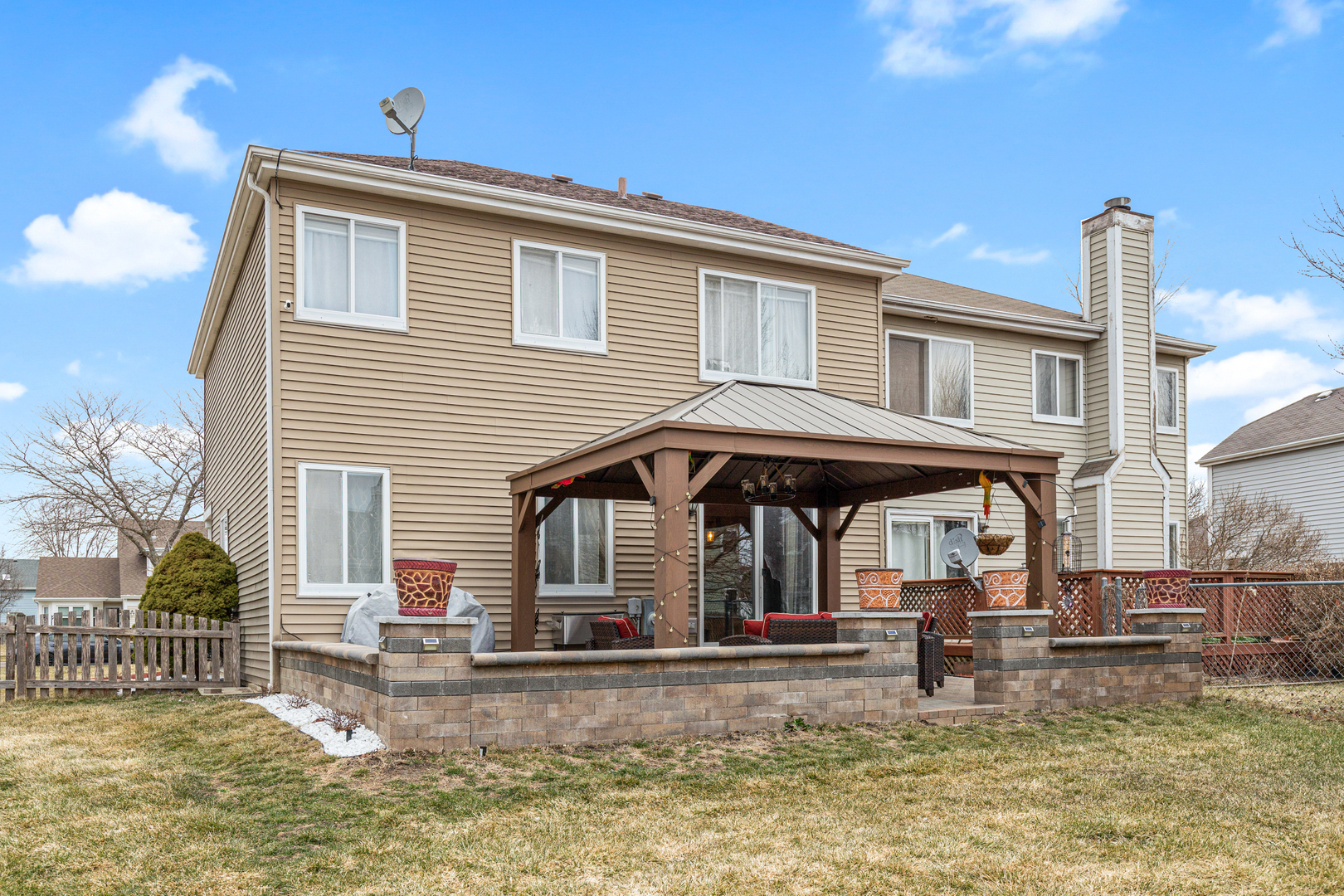 1467 Exeter Lane South Elgin, IL 60177 - Photo 20 of 29 a backyard of a house with yard table and chairs