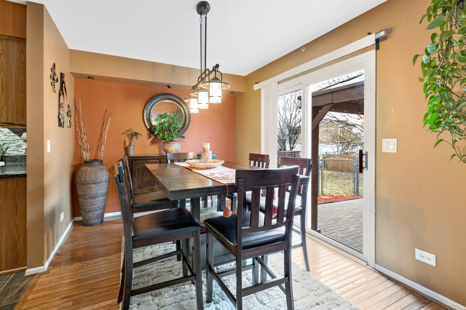 1467 Exeter Lane South Elgin, IL 60177 - Photo 5 of 29 a dining room with furniture a chandelier and wooden floor