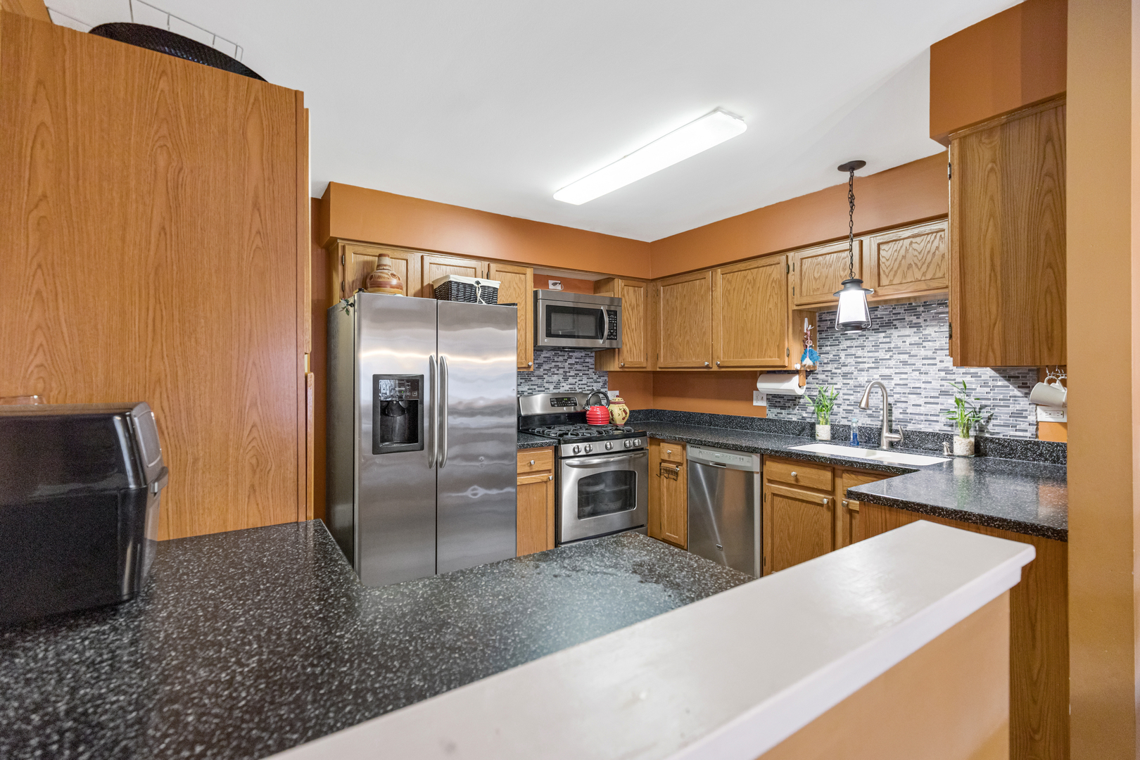 1467 Exeter Lane South Elgin, IL 60177 - Photo 7 of 29 a kitchen with stainless steel appliances kitchen island granite countertop a refrigerator and stove