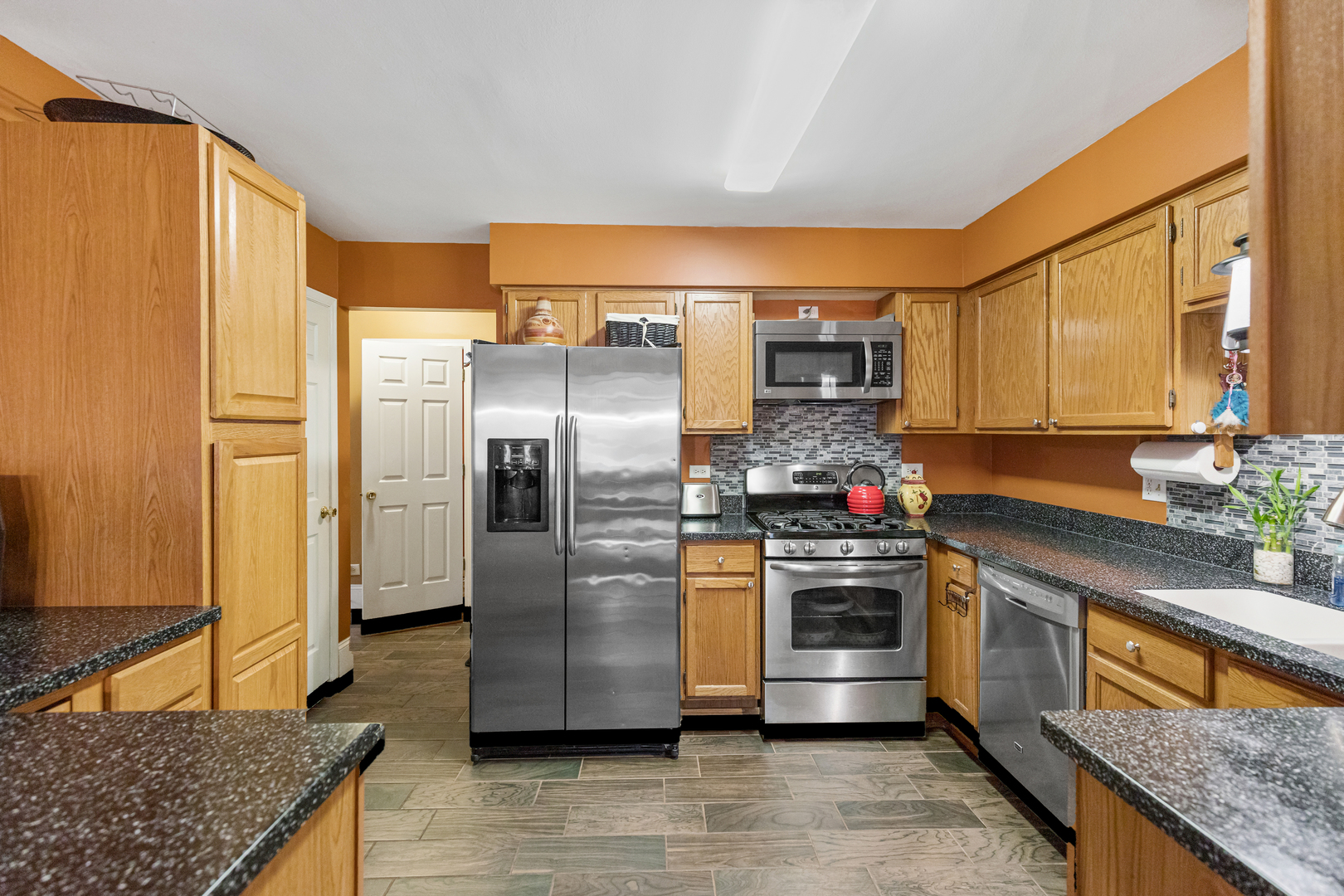 1467 Exeter Lane South Elgin, IL 60177 - Photo 8 of 29 a kitchen with stainless steel appliances granite countertop a refrigerator and a sink