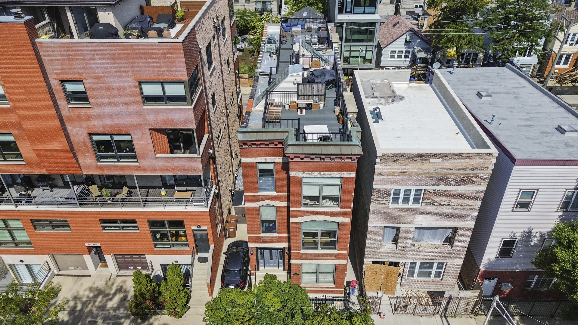 an aerial view of multi story residential apartment building