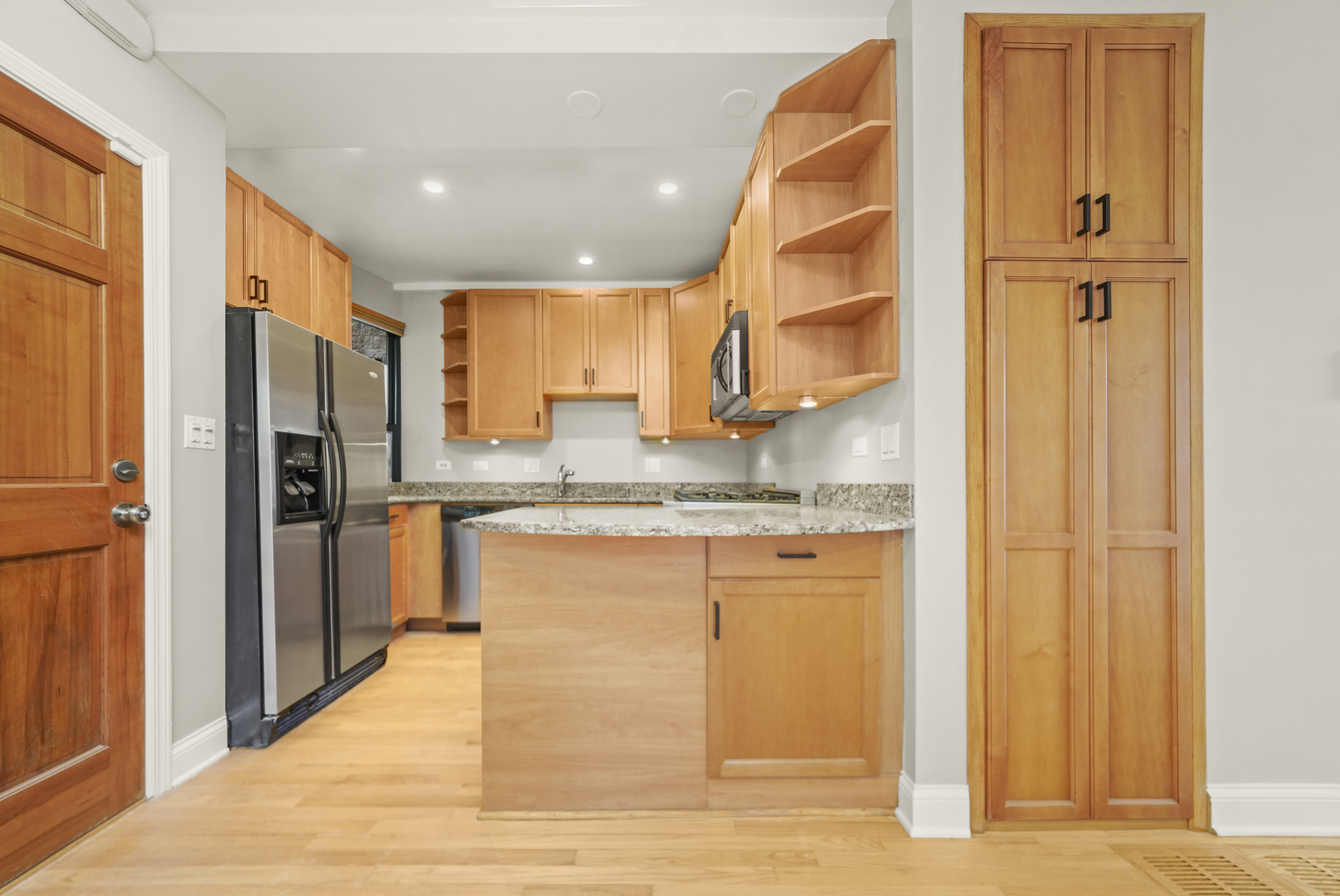 1640 West Ohio Street, Unit 1R Chicago, IL 60622 - Photo 2 of 13 a kitchen with stainless steel appliances granite countertop a refrigerator and a sink