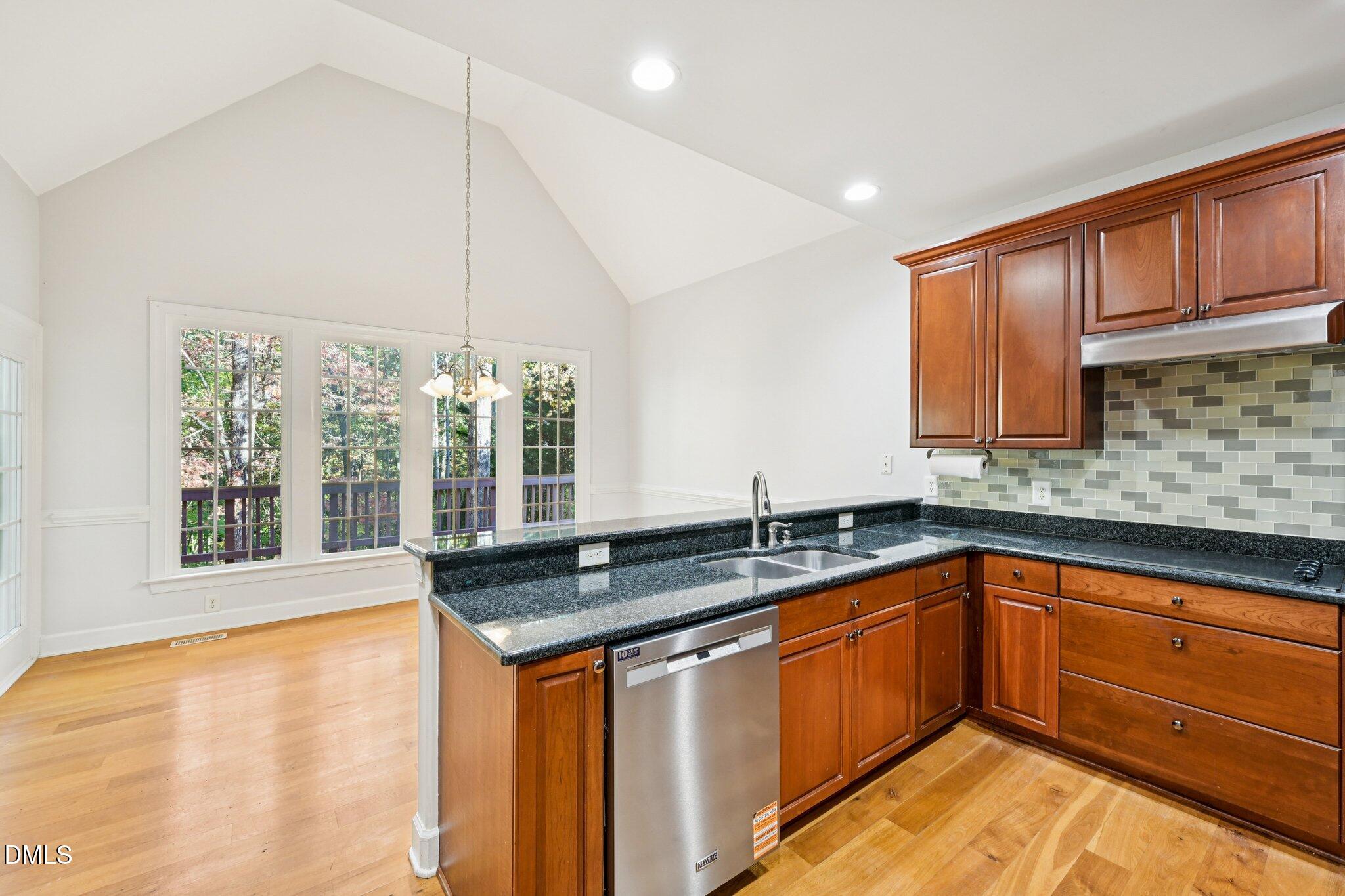 7628 Stony Hill Road Wake Forest, NC 27587 - Photo 14 of 33 a kitchen with a sink and large window
