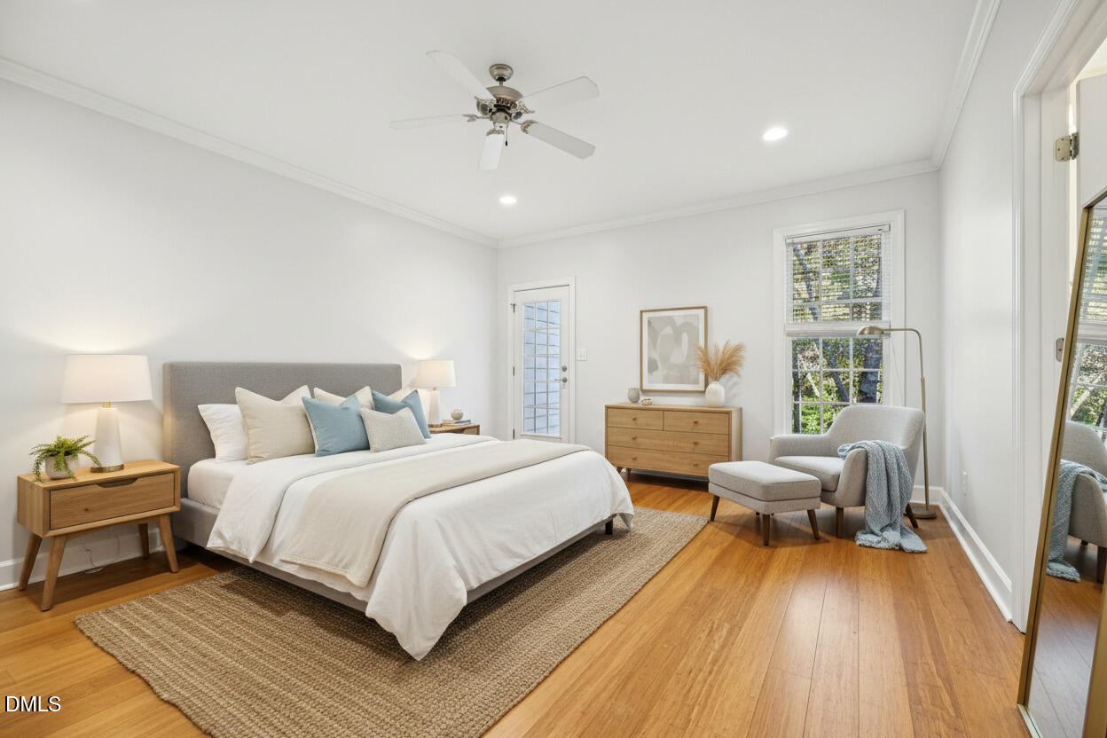 7628 Stony Hill Road Wake Forest, NC 27587 - Photo 20 of 33 a bedroom with a bed and wooden floor