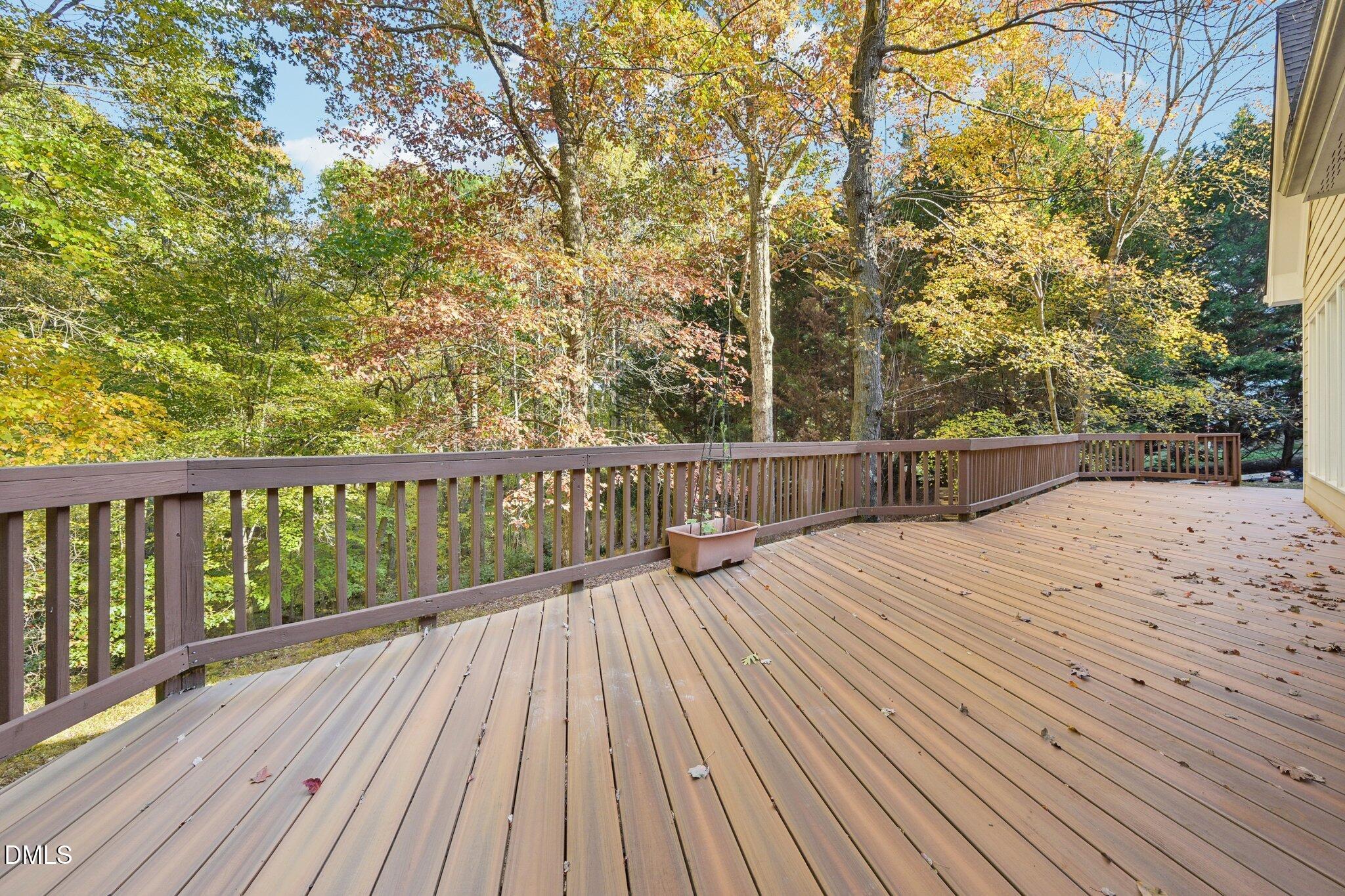 7628 Stony Hill Road Wake Forest, NC 27587 - Photo 30 of 33 a view of balcony with wooden floor and fence