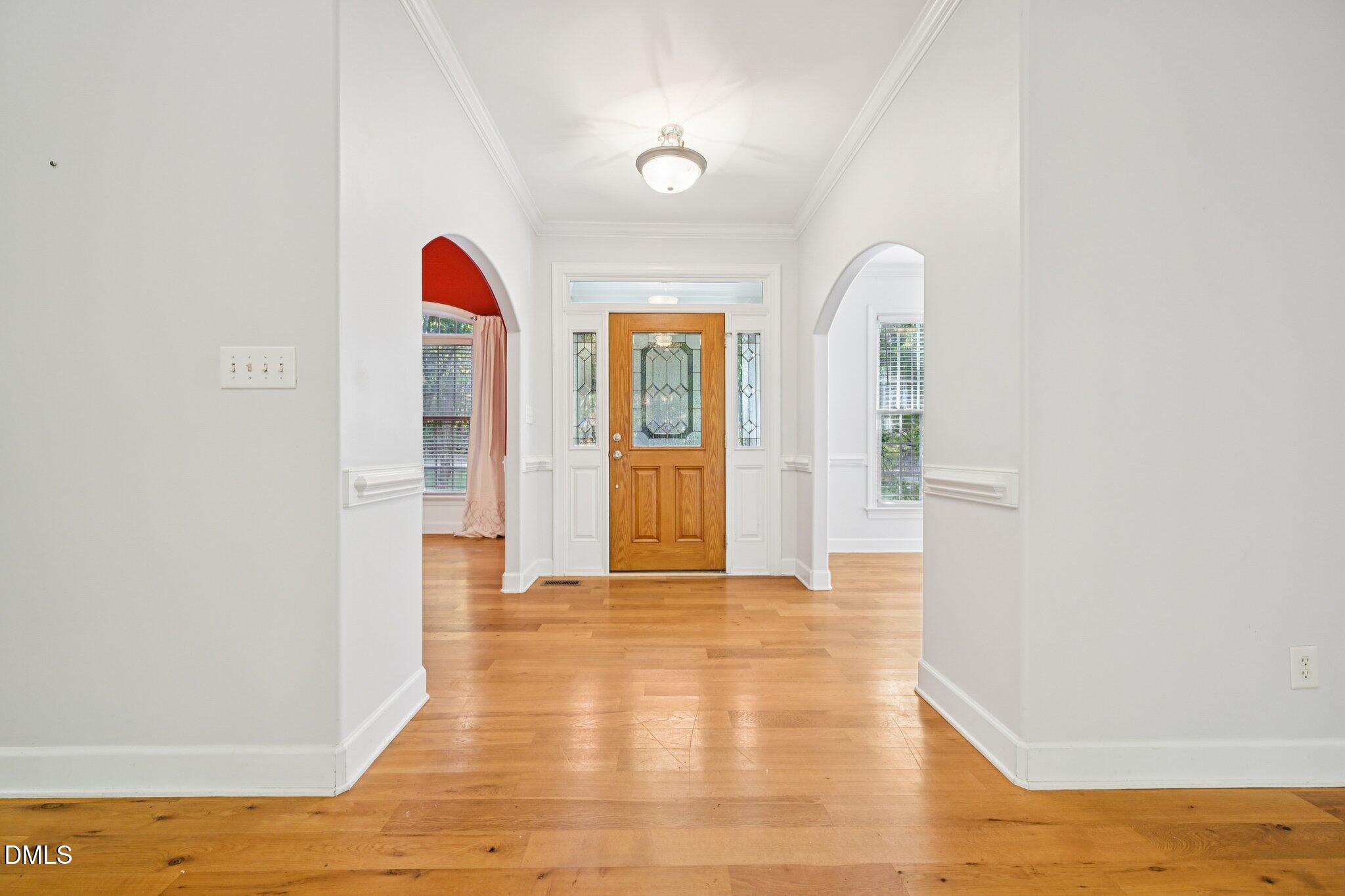 7628 Stony Hill Road Wake Forest, NC 27587 - Photo 3 of 33 a view of a room with wooden floor and window