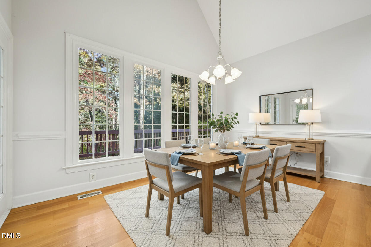 7628 Stony Hill Road Wake Forest, NC 27587 - Photo 8 of 33 a view of a dining room with furniture window and wooden floor