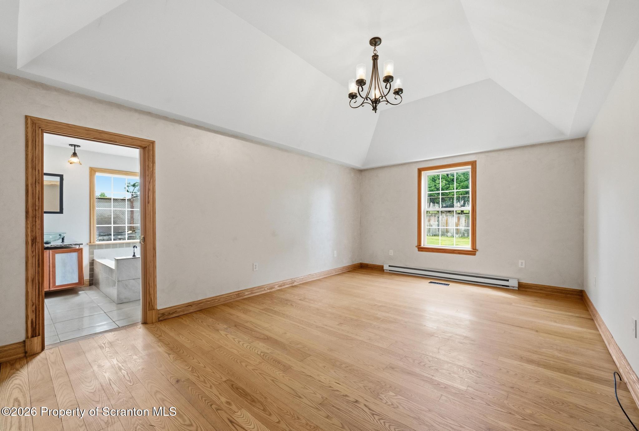 116 Forge Street Old Forge, PA 18518 - Photo 22 of 49 a view of an empty room with a window and wooden floor