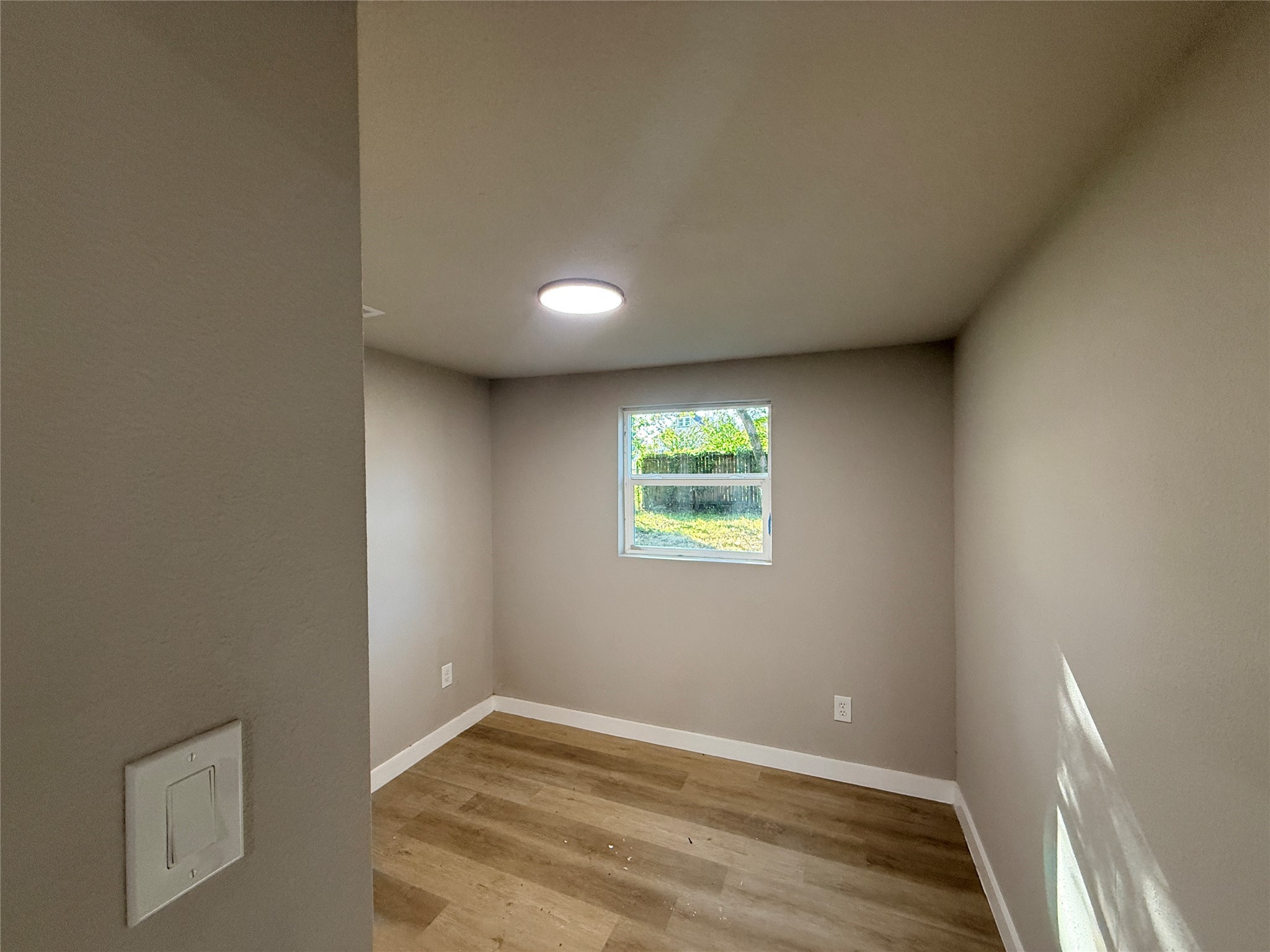 2209 Gano Street, Unit 3 Houston, TX 77009 - Photo 11 of 16 a view of an empty room with a window