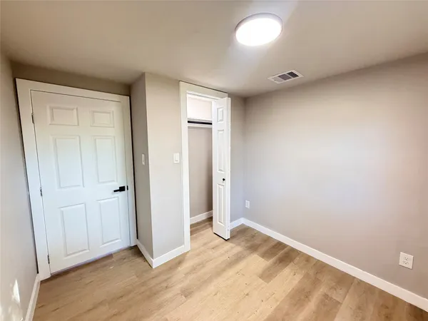 a bathroom with a bathtub toilet sink and mirror
