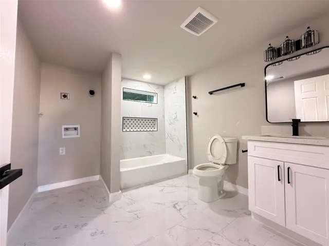 a bathroom with a sink and a window