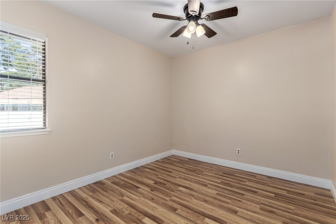 6465 West Plumcrest Road Las Vegas, NV 89108 - Photo 22 of 34 Spare room featuring wood finished floors and ceiling fan