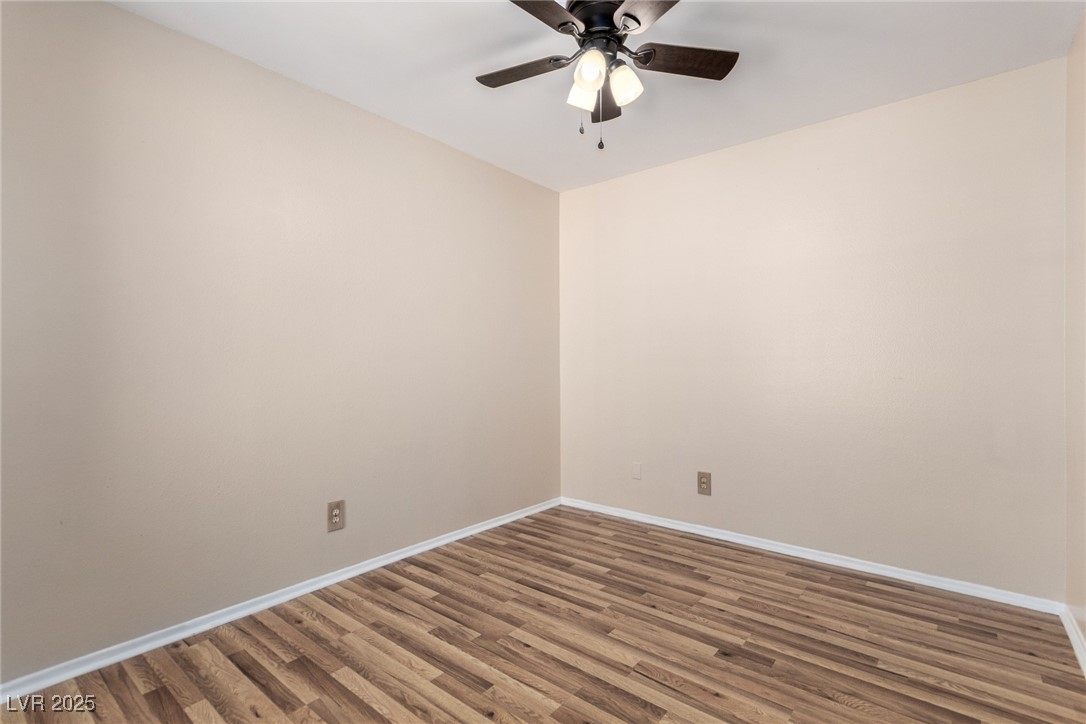6465 West Plumcrest Road Las Vegas, NV 89108 - Photo 24 of 34 Unfurnished room featuring wood finished floors and ceiling fan