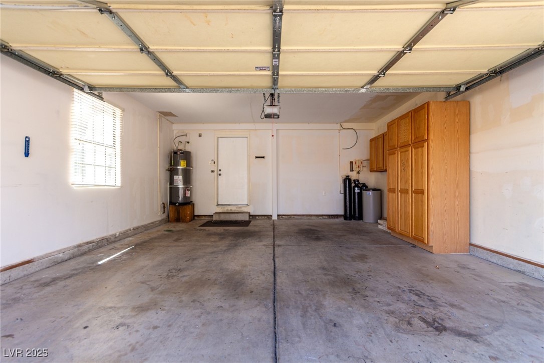 6465 West Plumcrest Road Las Vegas, NV 89108 - Photo 28 of 34 Garage with secured water heater and baseboards