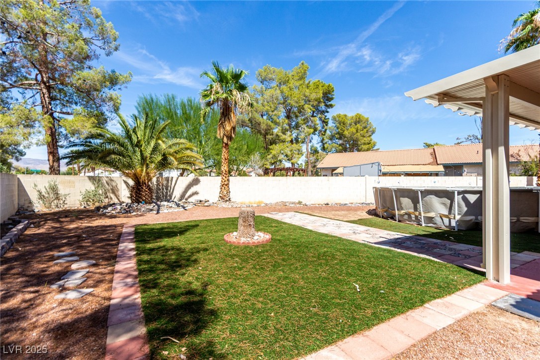 6465 West Plumcrest Road Las Vegas, NV 89108 - Photo 30 of 34 Fenced backyard featuring a patio area
