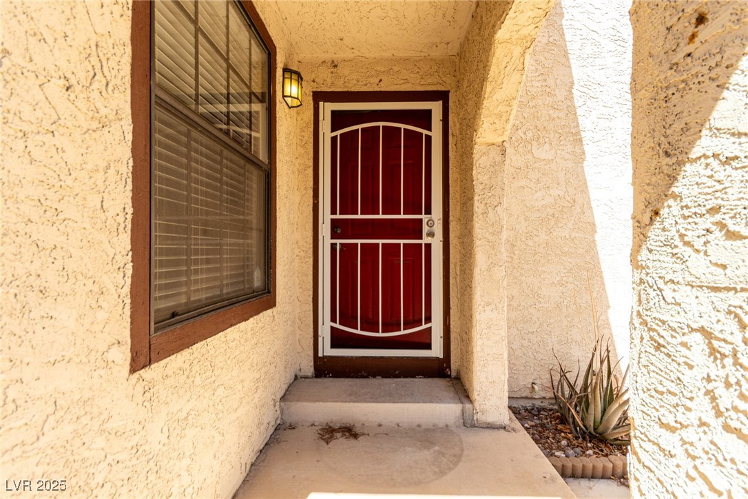 6465 West Plumcrest Road Las Vegas, NV 89108 - Photo 8 of 34 Entrance to property with stucco siding