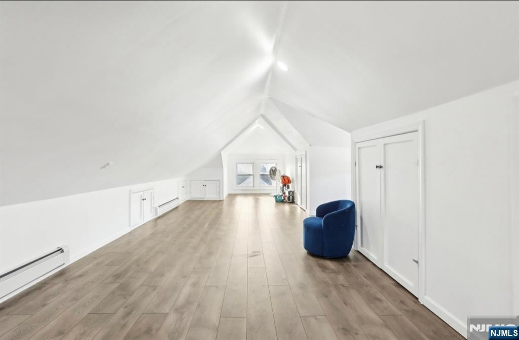 20 Borig Place, Unit 2 Lodi, NJ 07644 - Photo 2 of 11 a view of a livingroom with wooden floor and furniture