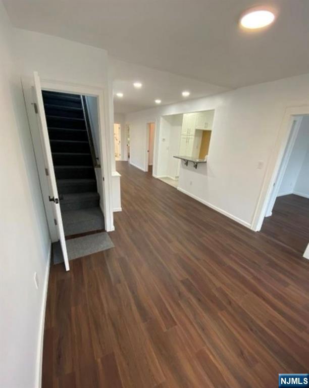 20 Borig Place, Unit 2 Lodi, NJ 07644 - Photo 3 of 11 wooden floor in an empty room with a mirror