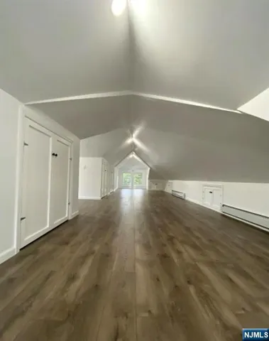 an empty room with wooden floor