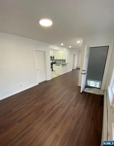 a view of a kitchen with a sink and a microwave