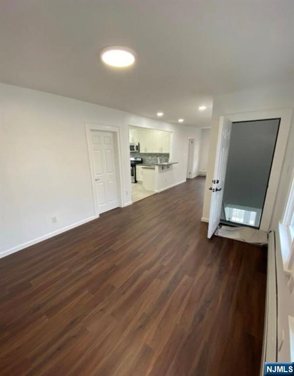 20 Borig Place, Unit 2 Lodi, NJ 07644 - Photo 5 of 11 a view of a kitchen with a sink and a microwave