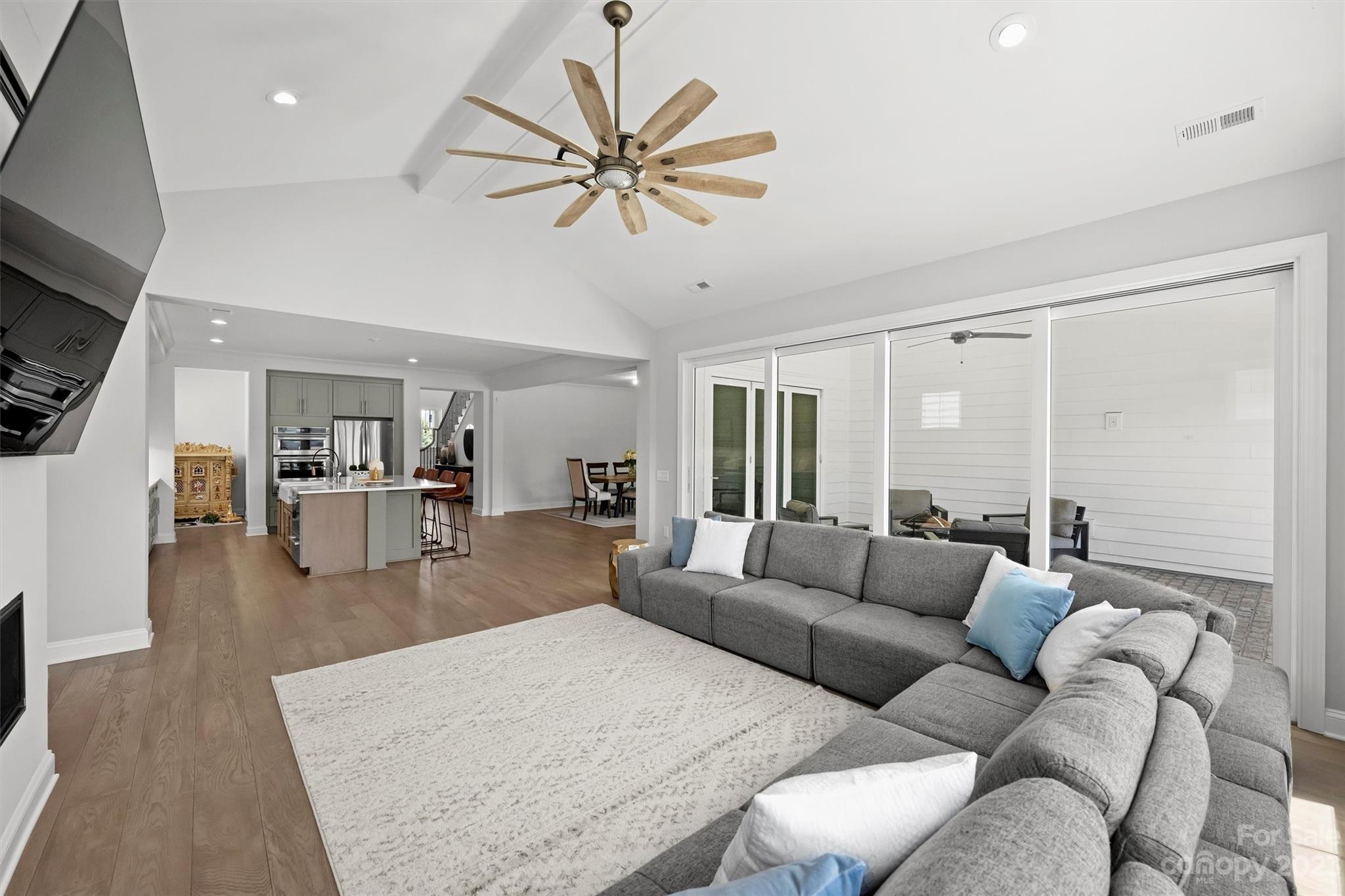 13228 Philip Michael Road Huntersville, NC 28078 - Photo 12 of 39 a living room with furniture and a view of kitchen