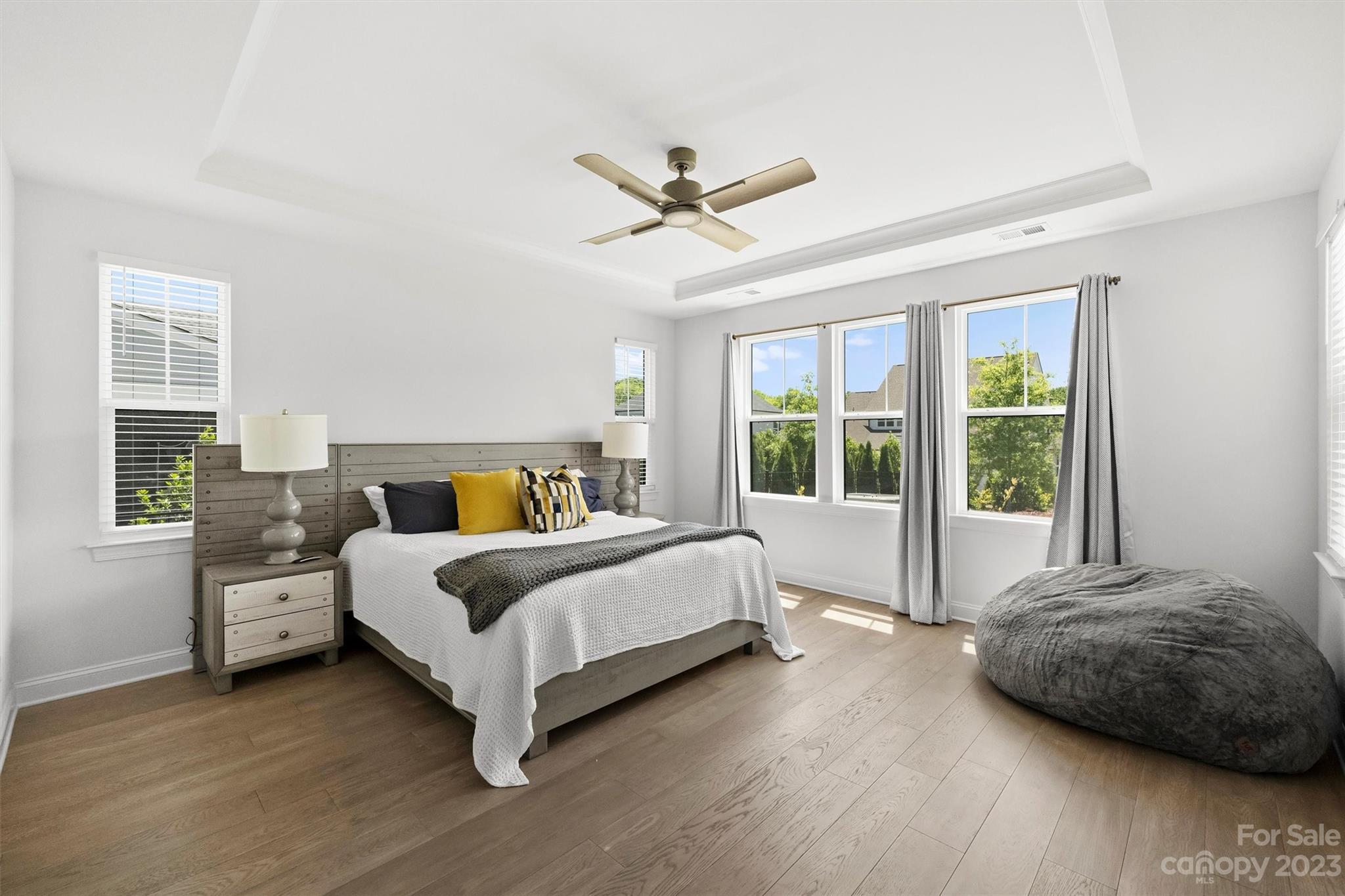 13228 Philip Michael Road Huntersville, NC 28078 - Photo 14 of 39 a spacious bedroom with a bed and a large window