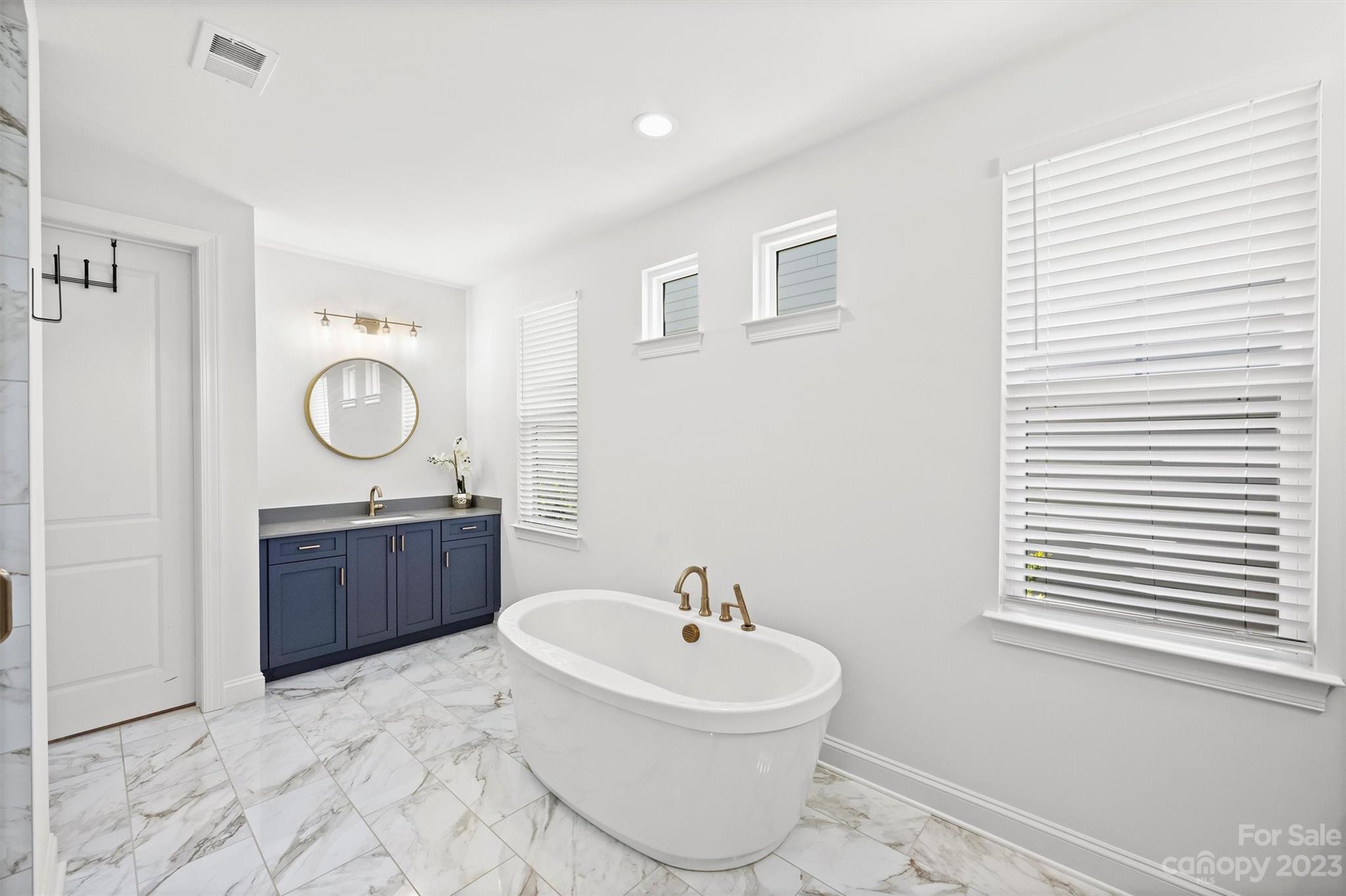 13228 Philip Michael Road Huntersville, NC 28078 - Photo 16 of 39 a bathroom with a sink a toilet and a mirror