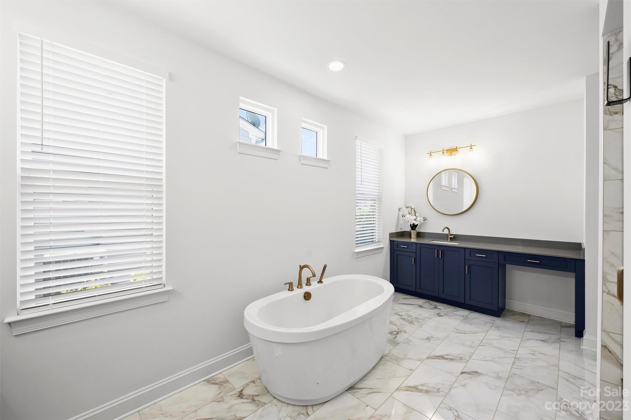 13228 Philip Michael Road Huntersville, NC 28078 - Photo 17 of 39 a bathroom with a sink a toilet and mirror