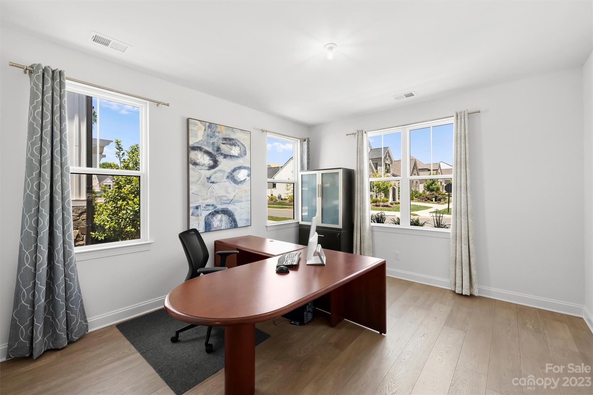 13228 Philip Michael Road Huntersville, NC 28078 - Photo 19 of 39 a view of a workspace with furniture and a window
