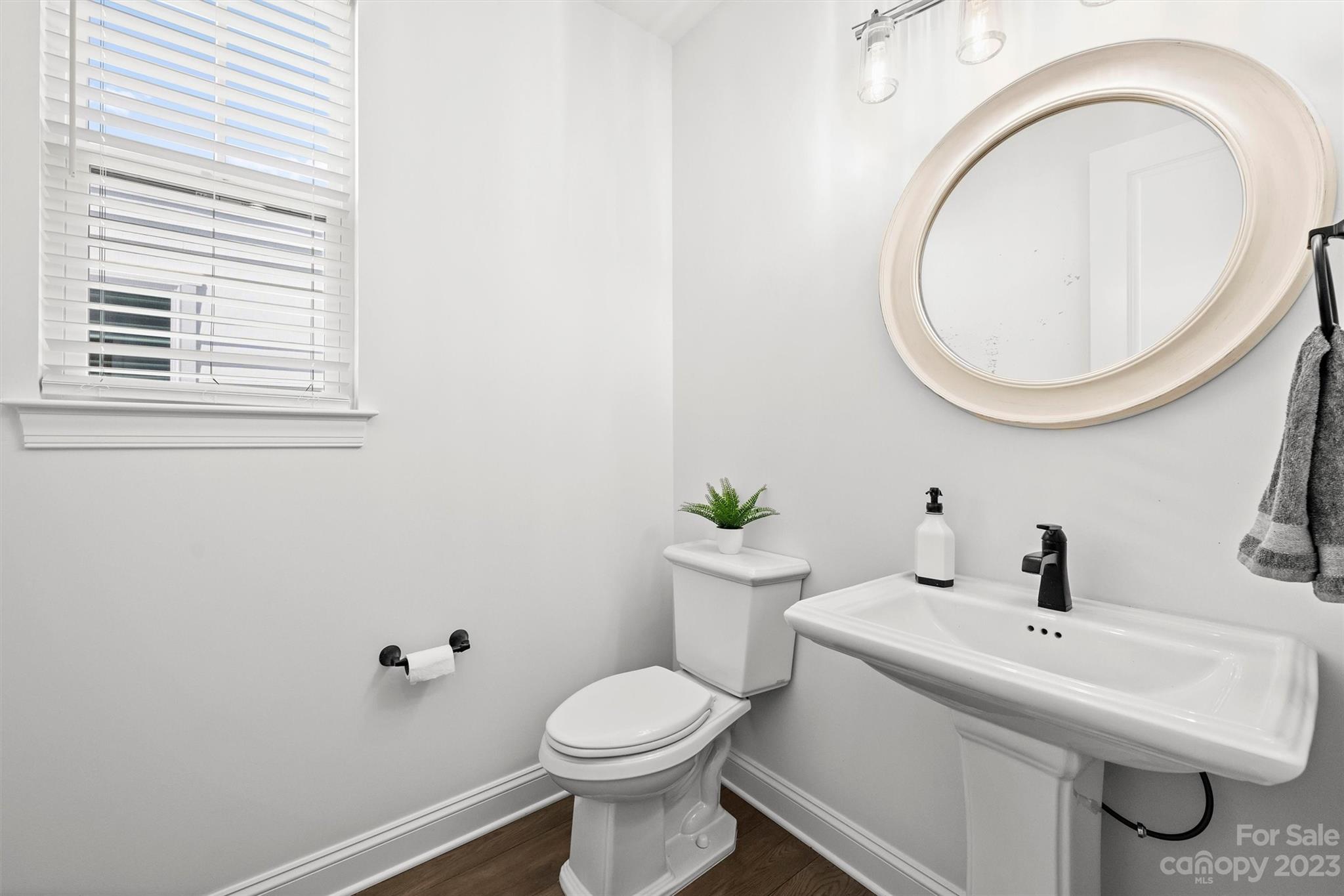 13228 Philip Michael Road Huntersville, NC 28078 - Photo 22 of 39 a bathroom with a sink and a mirror