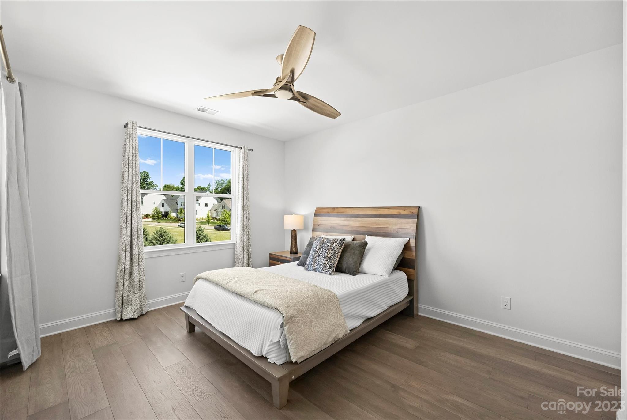 13228 Philip Michael Road Huntersville, NC 28078 - Photo 29 of 39 a bedroom with a bed and a window