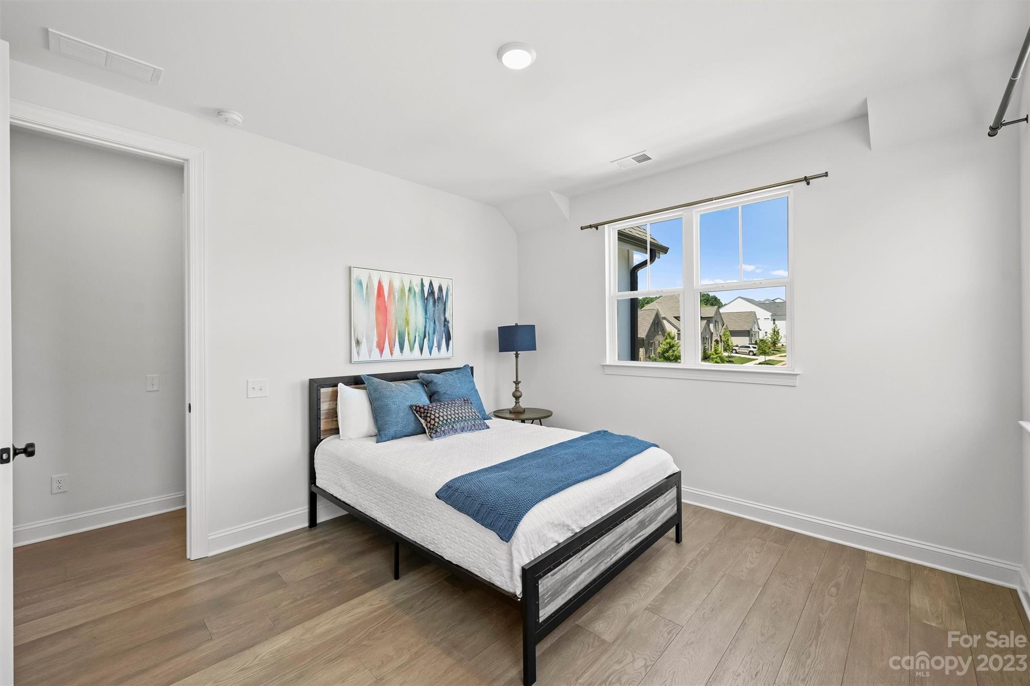 13228 Philip Michael Road Huntersville, NC 28078 - Photo 31 of 39 a bedroom with a bed and painting on the wall