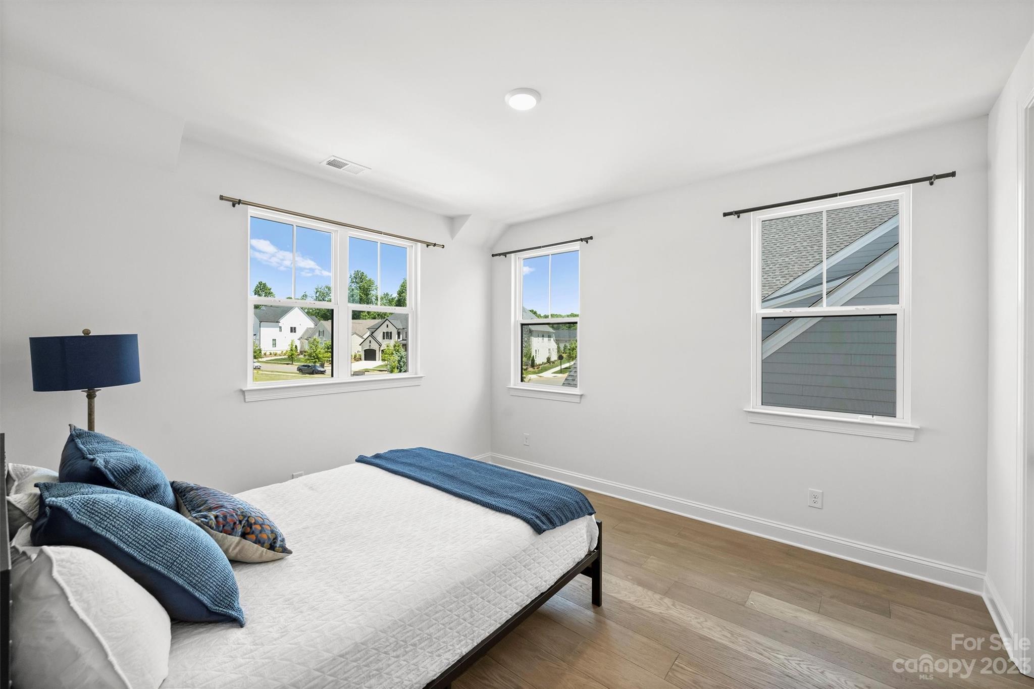 13228 Philip Michael Road Huntersville, NC 28078 - Photo 32 of 39 a bedroom with bed and a window