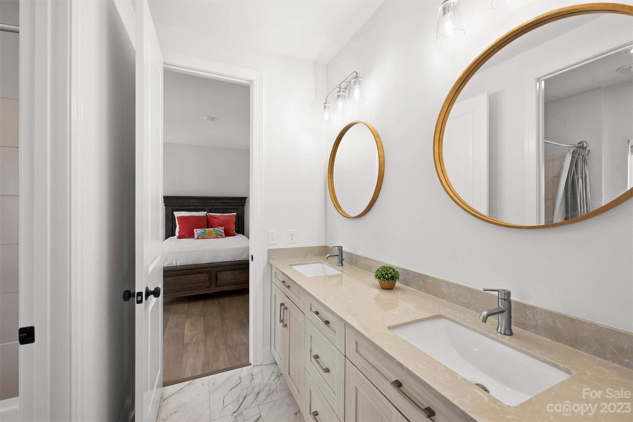 13228 Philip Michael Road Huntersville, NC 28078 - Photo 34 of 39 a en suite bathroom with a double vanity sink and a mirror