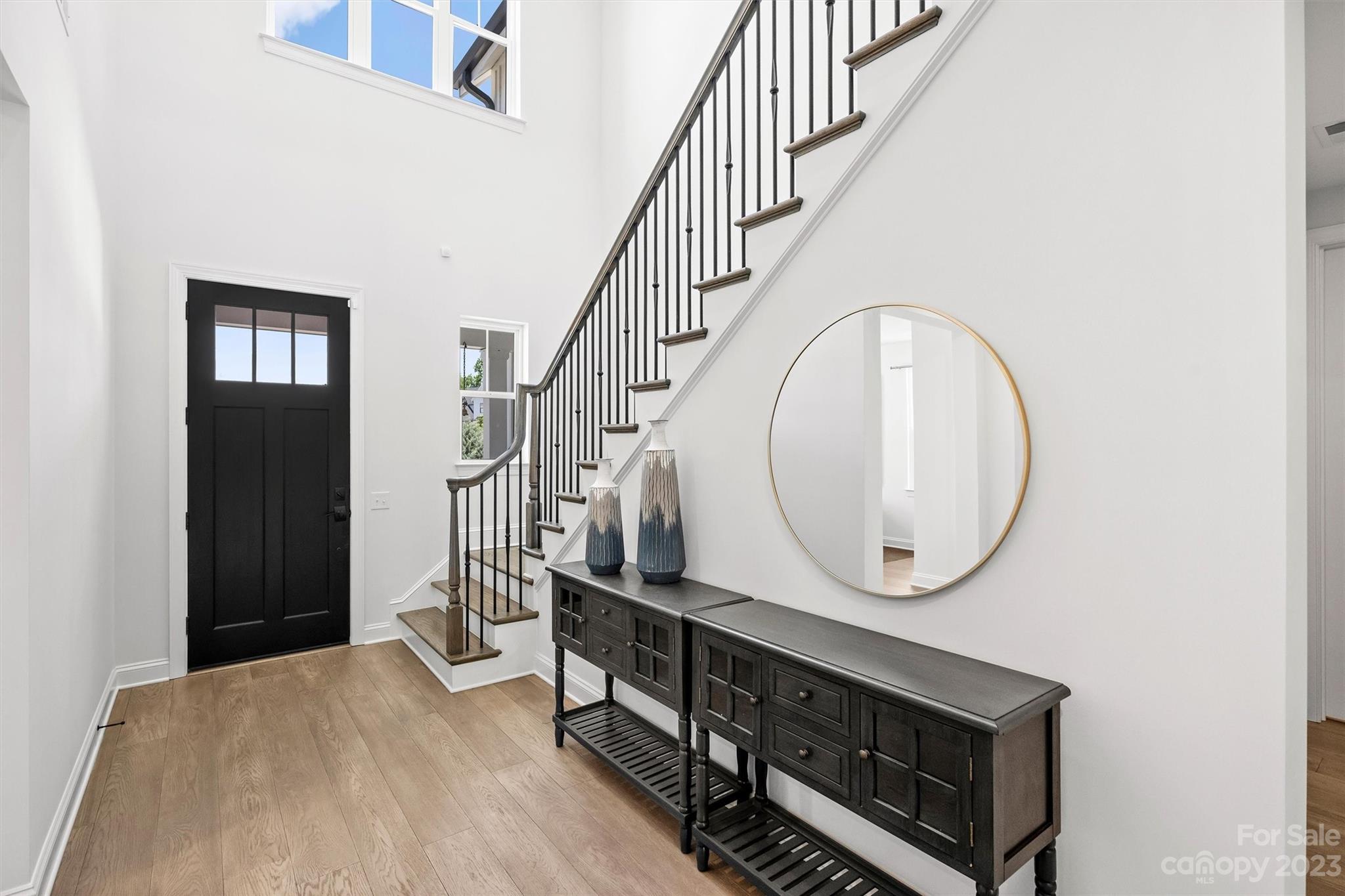 13228 Philip Michael Road Huntersville, NC 28078 - Photo 6 of 39 a view of an entryway with wooden floor and a front door