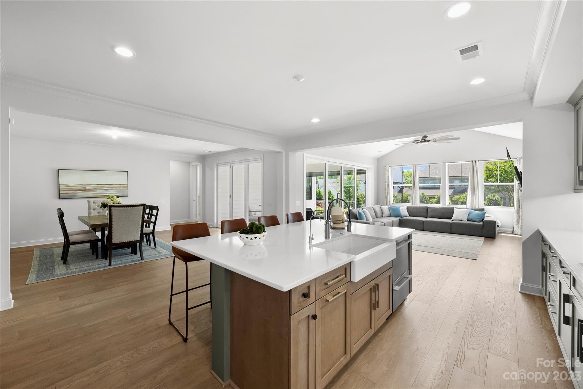 13228 Philip Michael Road Huntersville, NC 28078 - Photo 7 of 39 a open kitchen with sink cabinets and wooden floor
