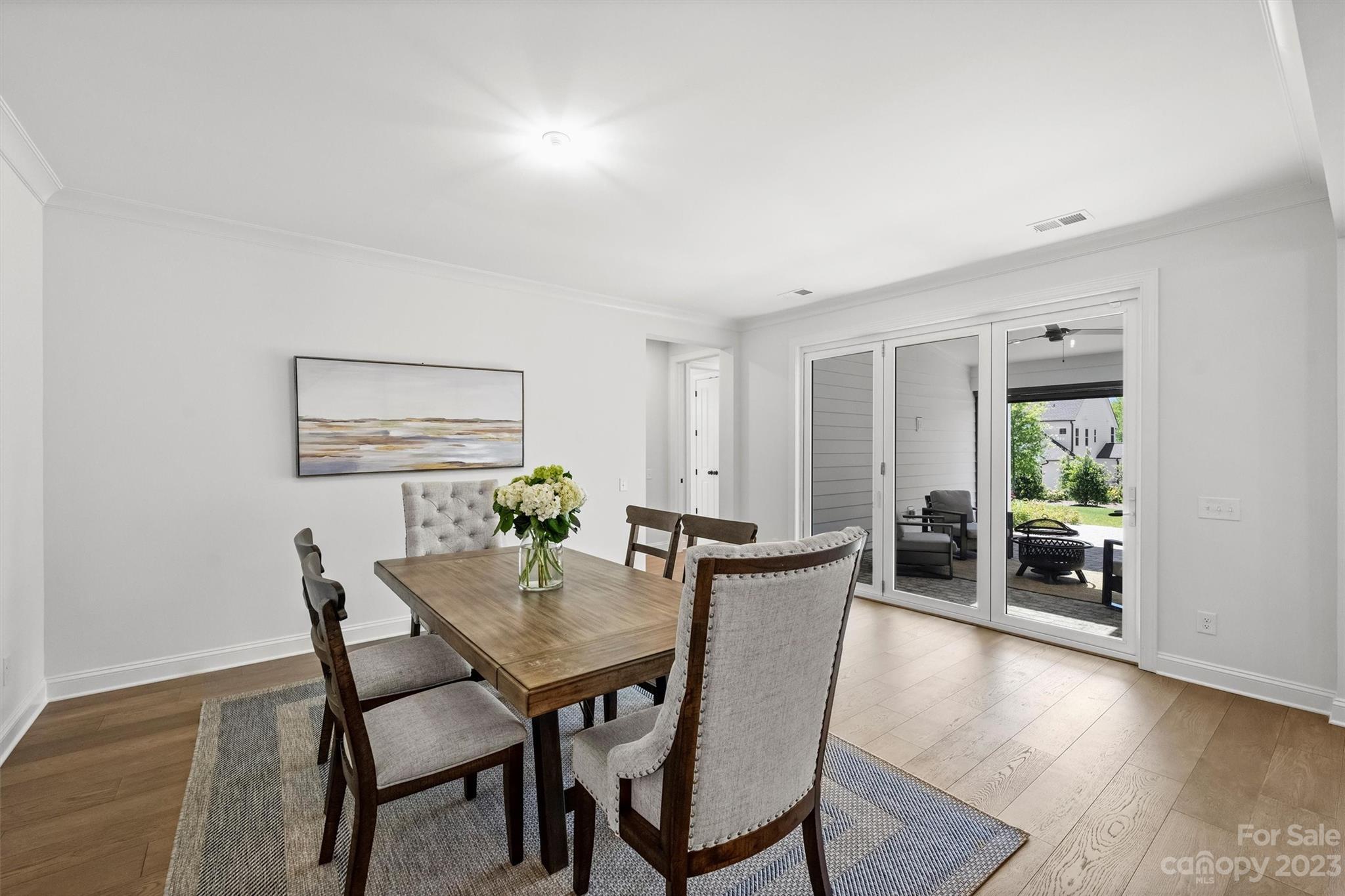 13228 Philip Michael Road Huntersville, NC 28078 - Photo 8 of 39 a view of a dining room with furniture window and wooden floor