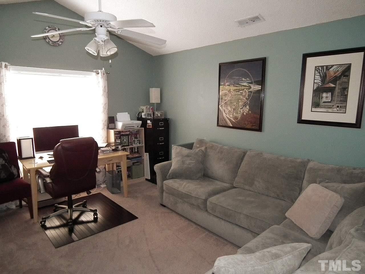 2033 Persimmon Ridge Drive Raleigh, NC 27604 - Photo 22 of 24 a living room with furniture