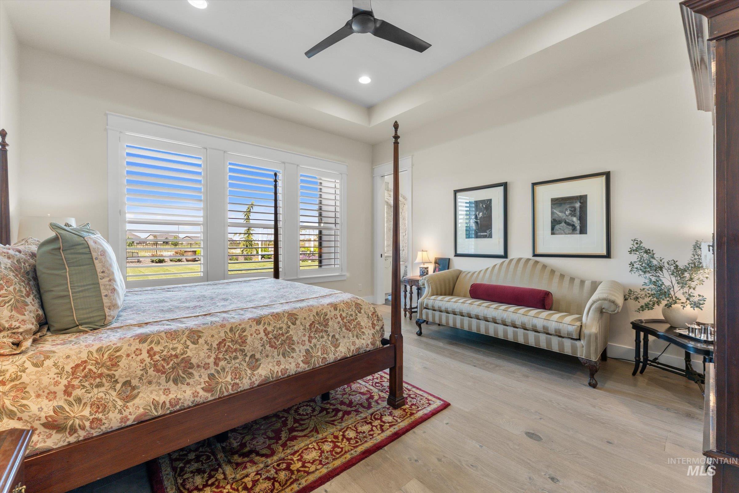 6585 South Pemberley Way Meridian, ID 83642 - Photo 24 of 43 Spacious room featuring light wood-finish flooring and a tray ceiling with recessed lighting