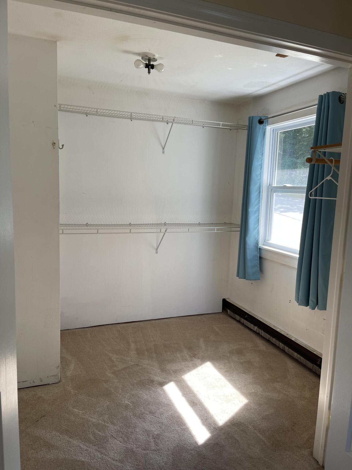 500 Mt Mica Road Paris, ME 04281 - Photo 16 of 27 Large master bedroom closet w/ a window