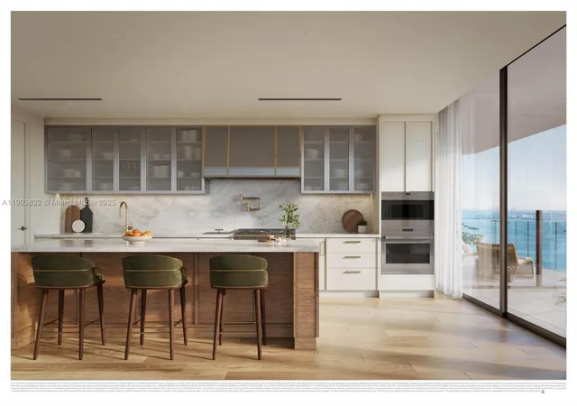 a kitchen with stainless steel appliances a sink and cabinets