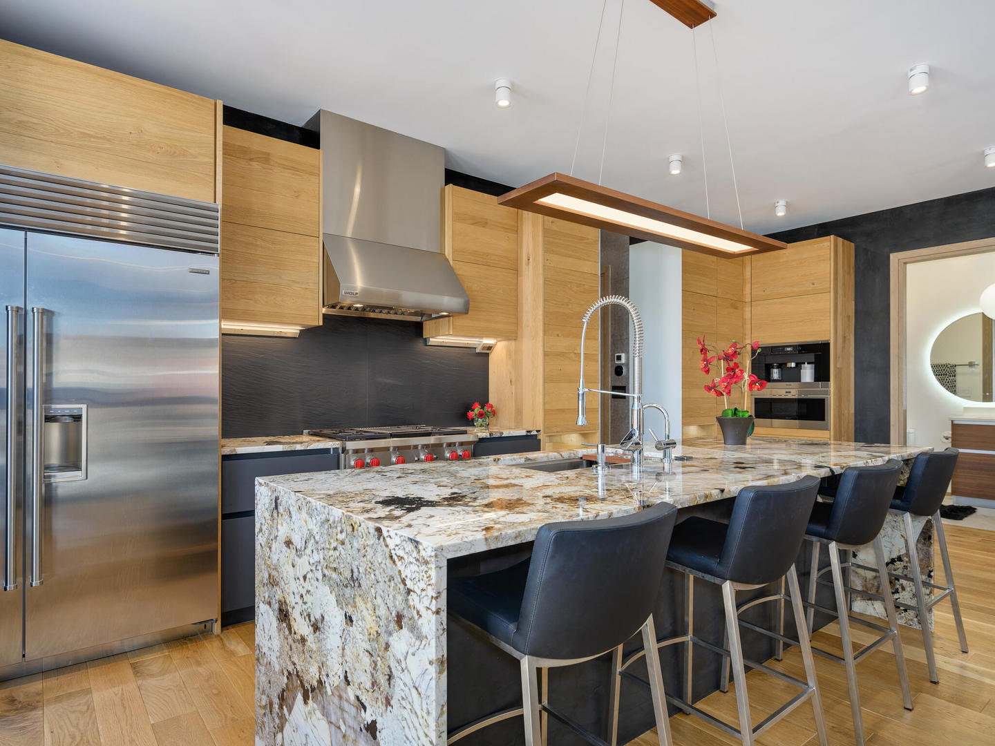 1601 West Ohio Street, Unit 2 Chicago, IL 60622 - Photo 12 of 31 a kitchen with stainless steel appliances kitchen island granite countertop a sink and cabinets