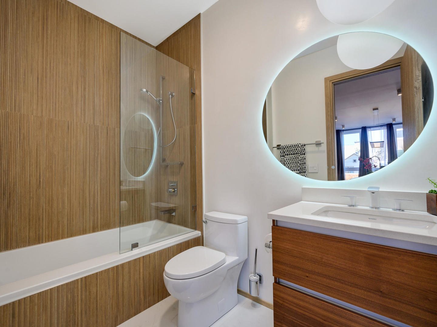 1601 West Ohio Street, Unit 2 Chicago, IL 60622 - Photo 17 of 31 a bathroom with a sink a toilet and a mirror