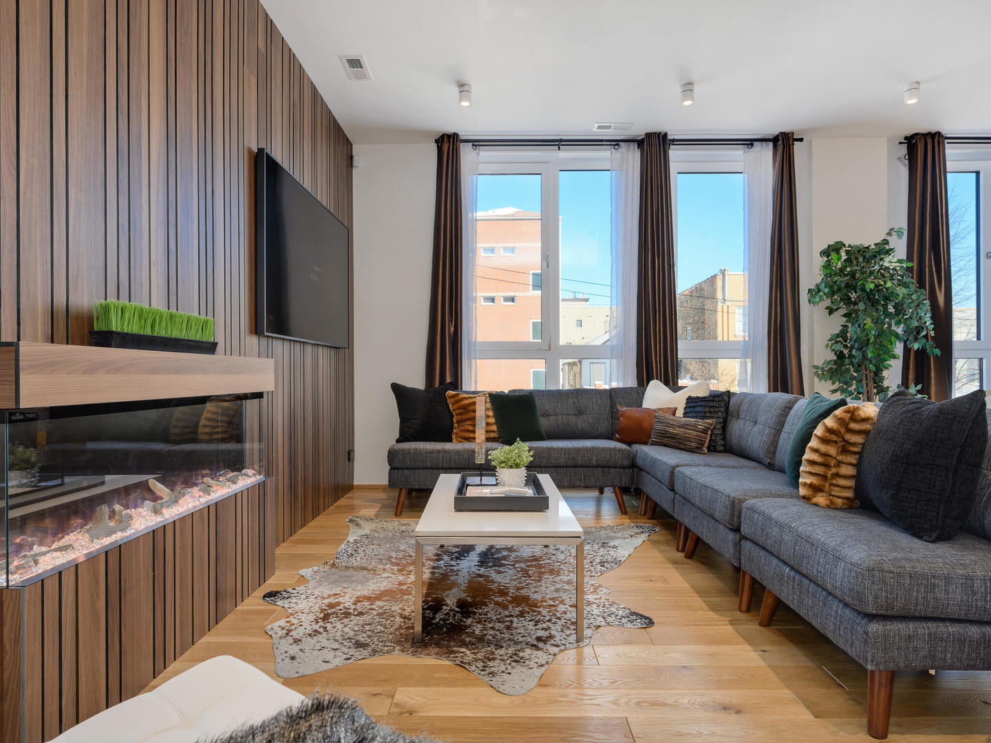 1601 West Ohio Street, Unit 2 Chicago, IL 60622 - Photo 2 of 31 a living room with furniture and a flat screen tv