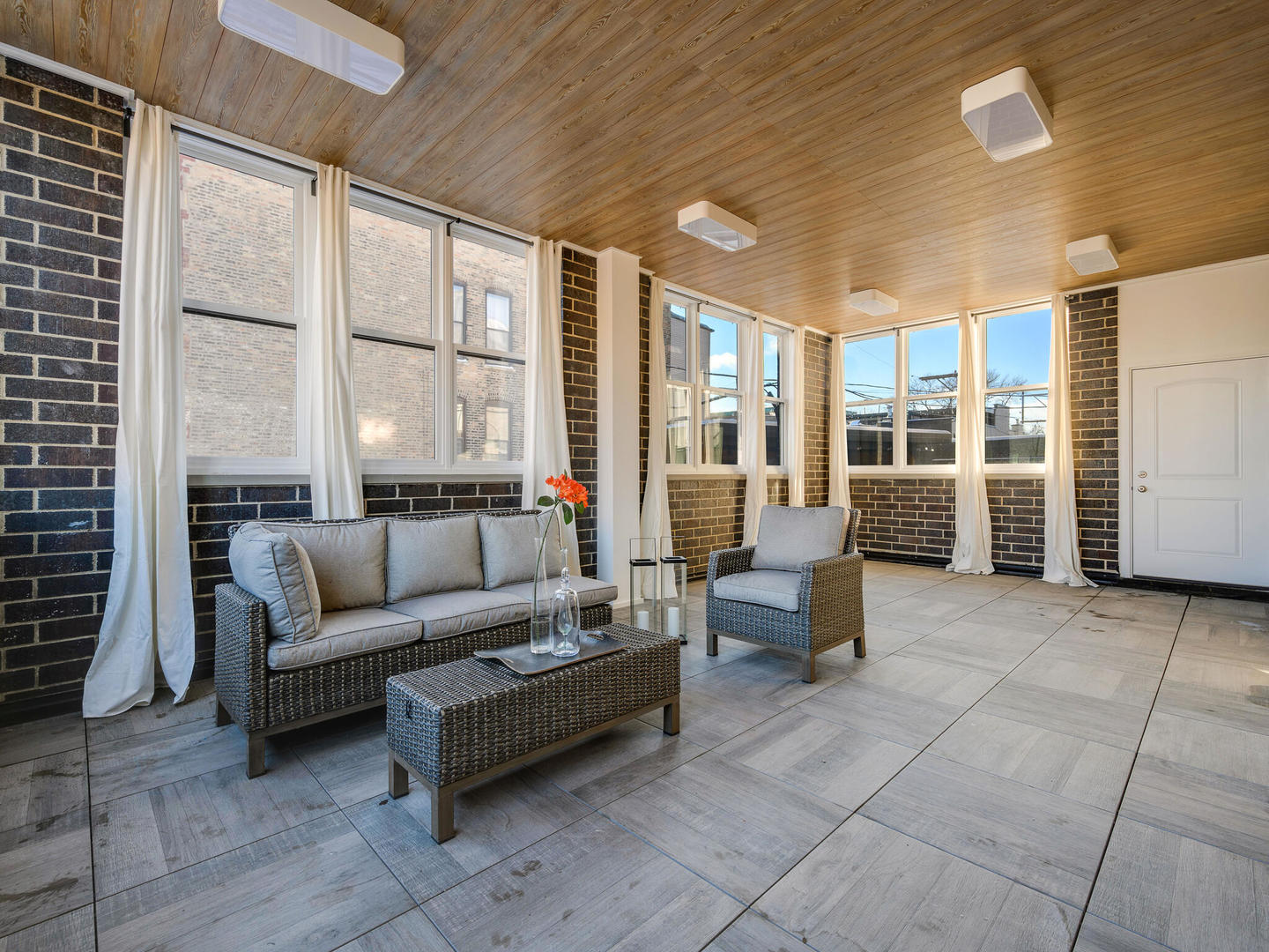 1601 West Ohio Street, Unit 2 Chicago, IL 60622 - Photo 23 of 31 a living room with furniture and large windows