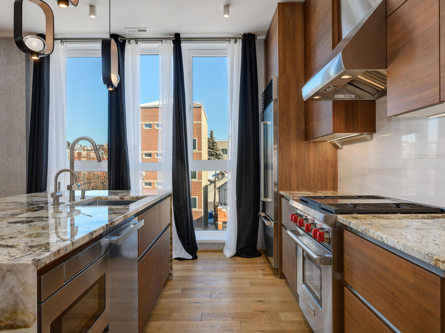 1601 West Ohio Street, Unit 2 Chicago, IL 60622 - Photo 30 of 31 a kitchen with stainless steel appliances granite countertop a stove and a sink