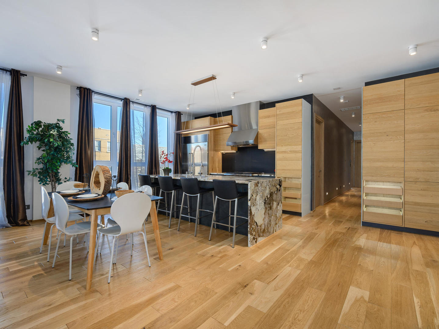 1601 West Ohio Street, Unit 2 Chicago, IL 60622 - Photo 6 of 31 a view of a dining room with furniture window and outside view