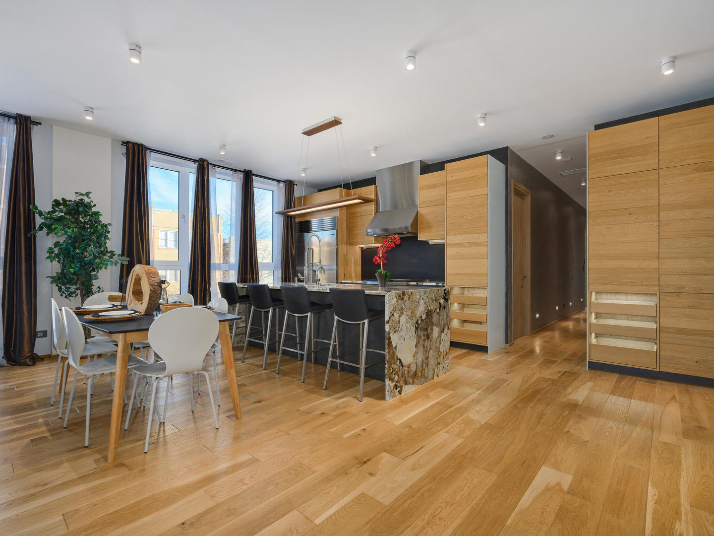 1601 West Ohio Street, Unit 2 Chicago, IL 60622 - Photo 9 of 31 a dining room with furniture window and wooden floor