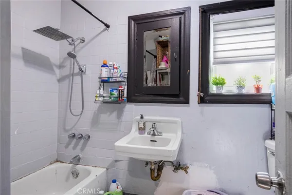 a bathroom with a sink toilet and a bathtub